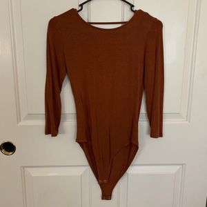 Burnt orange body suit